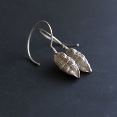 Nature earrings -Sterling silver dangle earrings -Cardamom earrings-Botanical jewelry -Nature jewelry -Gift for her -Gift for chef or cooks Sterling silver cardamom pod earrings nature cast from a real cardamom using the lost wax method. The cardamom soldered in Sterling silver wire hook and has matte finish. Material: Sterling silver Cardamom pod size : 2cm Total length:4cm Please note that every piece you purchase from cyklu is unique and handmade by me. You can make it yours or turn it into g Unique Linear Drop Earrings For Gift, Unique Linear Drop Earrings Gift, Handmade Sterling Silver Linear Earrings For Gifts, Handmade Sterling Silver Linear Earrings Gift, Nature-inspired Drop Earrings With Lever Back Ear Wires, Nickel-free Sterling Silver Nature-inspired Earrings, Sterling Silver Teardrop Linear Earrings For Gift, Silver Nature-inspired Earrings For Everyday, Silver Everyday Nature-inspired Earrings