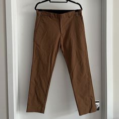 Club Monaco Connor Slim Fit Trousers/Pants. Like New, Never Worn. Still Very Firm And You Can Break In. Material Is A Great Blend That Keeps A Sharp Crease Or Flat Look. Brown Is A Camel Shade Of Color In Bright Light. Great To Dress Up Or Down. Waist: 33 / Length: 32 53% Cotton 44% Nylon 3% Elastic Casual Brown Slim Fit Dress Pants, Brown Tapered Leg Chinos For Work, Brown Slim Fit Pants For Work, Brown Slim Fit Bottoms With Welt Pockets, Brown Slim Fit Dress Pants With Tapered Leg, Slim Fit Brown Dress Pants With Tapered Leg, Casual Fitted Brown Dress Pants, Fitted Brown Chinos With Pockets, Brown Slim Fit Dress Pants For Business Casual