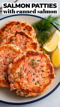 Salmon patties garnished with dill and lemon slices on a plate. Asian Salmon Patties, Salmon Cakes With Canned Salmon Southern, Baked Salmon Burgers, Baked Salmon Cakes With Canned Salmon, Gf Salmon Patties, How To Make Salmon Cakes, Salmon Patties With Canned Salmon, Salmon Patty Recipes Canned, Pouch Salmon Recipes