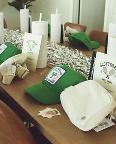 the table is set up with many items for tennis players to use on their team