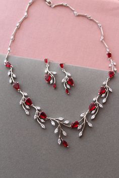 Wedding jewelry set Prom jewellery Color: rhodium-silver tone/clear/red Measurements: earrings approx 3.6 cm,width approx 12 mm( very delicate earrings not long). necklace approx 17.5 inches Materials: rhodium over brass findings, clear/red zirconia crystals. PACKAGING:simple as in stock at this moment. WEDDING JEWELRY: https://www.etsy.com/uk/shop/WeddingJewelryOutlet?ref=seller-platform-mcnav&section_id=26786154 WEDDING HEADPIECE: https://www.etsy.com/uk/shop/WeddingJewelryOutlet?ref=simple-sh Christmas Wedding Jewelry, Silver Jewellery Prom, Red And White Jewelry, Jewelry For Red Dress, 2024 Jewelry Trend, Red And Silver Jewelry, Red Wedding Jewelry, Crystals Packaging, Jewellery Set Bridal