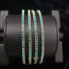 "* Handcrafted Gold Plated 4 Bangle Set. Sold as a set. * Bangles with high quality blue stones. * High Quality 22K Gold Plated. Bangles Sizes : 2.4 ( 2.20\" diameter of the inner circle) ; 2.6 ( 2.40\" diameter of the inner circle); 2.8 (2.50\" diameter of the inner circle) The gorgeous gold-plated bangles set best exemplifies the careful craftsmanship done on it -- specially picked for you by Nemali Jewelry. It has a special tone of elegance attached to it. The intricate handmade design of the Festive Blue Round Bangle, Adjustable Round Blue Bangle, Blue Hand Set Bangle For Wedding, Blue Hand-set Bangle For Wedding, Blue Hand-set Bracelet As A Gift, Adjustable Blue Stackable Bangle, Blue Festive Bracelet Jewelry, Festive Blue Bracelet Jewelry, Festive Blue Bracelet