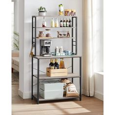 a shelf with bottles, soaps and other items on it in a living room