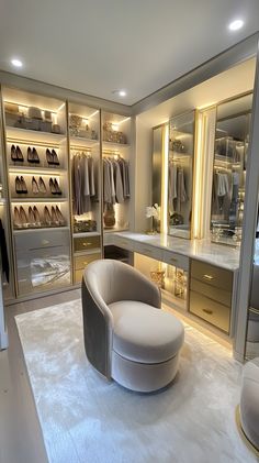 a large walk in closet filled with lots of clothes