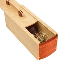 an open wooden box with various items inside