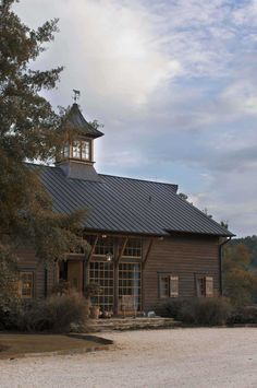 an old wooden building with a clock tower