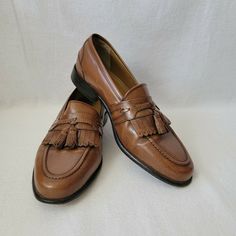 Florsheim Cognac Naples Kiltie Tassel Moc Dress Loafer Size Mens 9.5 D Model 18498 03 Pre-owned, good condition. Does NOT include original box. As always please see photos for details of the exact item you're buying. My items are sold as is and no returns. I take pride in providing quality photos with a quality description to ensure no returns or confusion. If you have any questions just ask!! Elegant Brown Tassel Loafers For Formal Occasions, Formal Slip-on Oxfords With Tassels, Classic Brown Tassel Loafers For Formal Occasions, Vintage Moc Toe Dress Shoes For Semi-formal Occasions, Formal Brown Dress Shoes With Tassels, Formal Wingtip Oxfords With Tassels, Elegant Formal Fitted Tassel Loafers, Classic Fitted Tassel Loafers For Business, Classic Wingtip Dress Shoes With Tassels