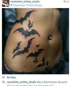 a woman's stomach with bats on it and the bottom part of her belly