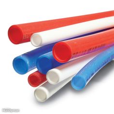 four different colored plastic pipes stacked on top of each other with the end painted red, white and blue