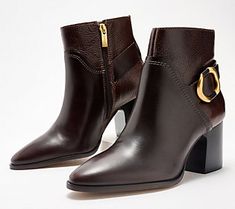 Punctuated with a sleek equestrian-style buckle, these chic leather ankle boots bring an edgy energy to any outfit (complete with an inside zipper for easy entry). From Vince Camuto. Leather Boots With Horsebit Detail For Work, Fall Heeled Boots With Buckle Closure For Office, Fall Office Heeled Boots With Buckle Closure, Elegant Moto Boots With Buckle For Work, Elegant Moto Boots With Buckle Closure For Work, Fall Office Boots With Buckle Closure, Chic Leather Moto Boots For Workwear, Luxury Moto Boots With Buckle Closure For Fall, Chic Business Boots With Buckle Closure