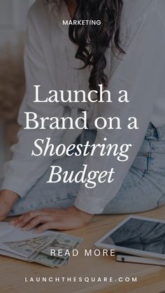 a woman sitting at a table with money in front of her and the words launch a brand on a shoetring budget