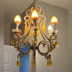 a chandelier hanging from the ceiling in a room