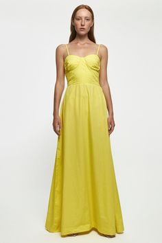 a woman in a yellow dress