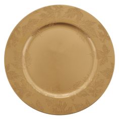 a gold plate with leaves on it