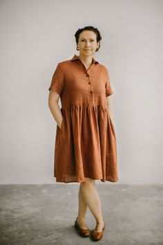 Casual plus size linen dress with cute wooden buttons in the front, 3/4 sleeves and full skirt part. This dress has true summer vibe, it is airy, breathable, has perfect midi length - it is your casual elegance for any life moment. Dress has two comfortable inseam side pockets and boat neckline. Linen fabric I use for all my garments is linen organic fabric, that has medium weight and thus is breathable and absolutely skin-friendly. Choose one of 25 colors in the color palette and enjoy this and Brown Cotton Shirt Dress For Summer, Bohemian Short Sleeve Midi Dress With Buttons, Bohemian Midi Dress With Buttons And Short Sleeves, Summer Linen Dress With Button Closure And Relaxed Fit, Bohemian Dresses With Button Closure And Short Sleeves, Short Sleeve Linen Sundress, Summer Linen Dress With Half Sleeves, Bohemian Linen Dress With Short Sleeves, Half Sleeve Linen Dress For Summer