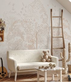 a living room filled with furniture and wallpaper covered in trees on the walls next to a ladder