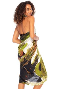 HAWAIIAN PARROT SARONG. Striking parrot sarong wrap with vibrant tropical colors gives you an exotic look and feel. Trimmed with boho fringed edges. Includes a coconut clip for easy tying GENEROUSLY SIZED at 67?x 45?, this swimsuit cover up fits most sizes. Wear it as a sarong skirt, wrap as a pareo dress, or wear as a shawl. Use for a beach blanket, tablecloth, even a colorful wall hanging 100% RAYON. With a soft, silky feel, rayon is a natural fiber that lets skin breathe. This bathing suit or