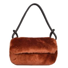 Super luxurious statement sheepskin bag our Whitby, shown here in Burnt orange shearling that oozes quality. Lightweight, Lined with extra large leather zipper internal pocket.  The deluxe leather handle, generously proportioned for your comfort, accommodates even the chunkiest winter coats, allowing you to carry Whitby in style effortlessly. The interior of Whitby is lined with our classic British cotton twill fabric, showcasing both durability and sophistication. 100% sheepskin. made in Englan Leather Evening Bags For Winter, Fall Brown Shoulder Bag With Faux Fur Lining, Brown Shoulder Bag With Faux Fur Lining For Fall, Brown Leather Bag With Faux Fur Lining, Brown Sheepskin Bags For Winter, Winter Sheepskin Rectangular Bag, Winter Rectangular Sheepskin Bags, Luxury Faux Fur Shoulder Bag For Everyday Use, Leather Bags With Plush Lining For Everyday Use