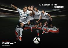 three soccer players are kicking a ball in front of an advertise for nike