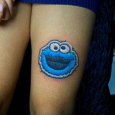 a close up of a person with a tattoo on their thigh