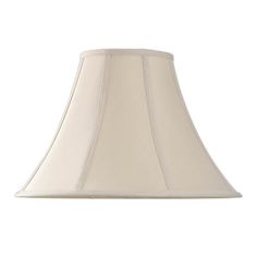 a white lamp shade is shown against a white background with the light on it's side