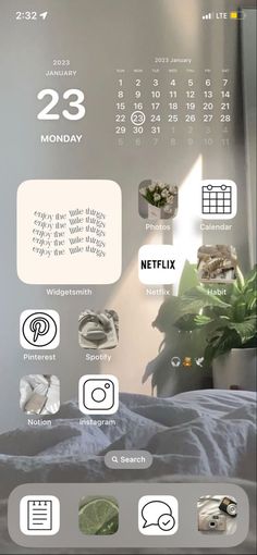 an image of a calendar on the wall above a bed with plants and other things around it