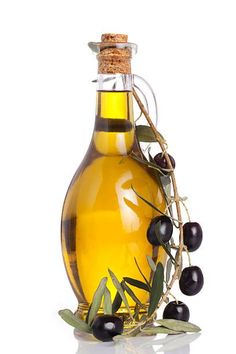 an olive oil bottle and some black olives