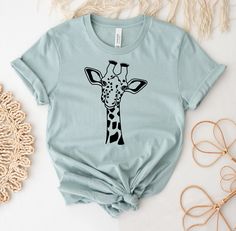 a t - shirt with a giraffe drawn on it