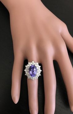 7.30 Carats Natural Very Nice Looking Tanzanite and Diamond 14K Solid White Gold Ring Suggested Replacement Value: Approx. $9,200.00 Total Natural Oval Cut Tanzanite Weight is: Approx. 5.50 Carats Tanzanite Measures: Approx. 12.80 x 9.40mm Natural Round Diamonds Weight: Approx. 1.80 Carats (color G-H / Clarity SI1-SI2) Ring total weight: Approx. 8.4 grams Disclaimer: all weights, measurements and colors are approximate and may vary slightly from the listed dimensions or as seen in the image. All Gia Certified Gemstones For Formal Occasions, Elegant Gia Certified Gemstones For Wedding, Luxury Gia Certified Tanzanite Diamond Ring, Luxury Tanzanite Diamond Ring Gia Certified, Exquisite Tanzanite Rings, Luxury Pear-shaped Tanzanite Jewelry, Luxury Tanzanite Pear-shaped Jewelry, Exquisite Tanzanite Anniversary Jewelry, Exquisite Tanzanite Anniversary Ring