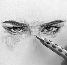 a pencil drawing of a person's eye with the tip of a pen in front of it