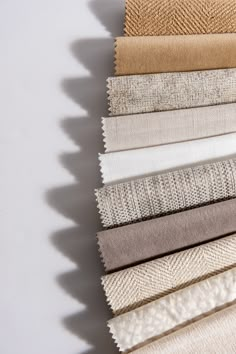 An array of Jamie Stern Fabrics in neutral colors ranging from gold and white to gray and cream. Sofa Fabric Texture, High End Residential, Fabric Store Design, Interior Design Fabric, Modern Sofa Designs, Fabric Patterns Design, Fabric Display, Textile Company