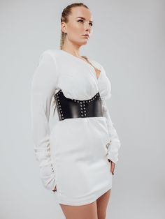 The model is wearing a size XL and is 33.5"/85 cm waist, 35"/89 cm underbust.Get ready to shine with the Westworld Corset! This stunning accessory delicately frames your waist and defines your curves, adding a touch of glamour to any outfit. Whether worn seamlessly over fitted garments or cinched in something more oversized, this corset is sure to turn heads. Evening Corset Belt With Boning, White Corset For Club, White Fitted Corset For Club, White Fitted Corset For Club Wear, Chic White Underbust Corset, Elegant Underbust Corset For Costume Party, Feminine Fitted Corset Dress For Formal Occasions, Luxury Corset Belt, Luxury Fitted Corset Belt