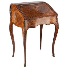 an antique wooden table with two legs and a small drawer on one side, inlaid to the top