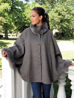 Dress it up or dress it down, you will love the way this enchanting cape complements everything you wear. Discovered during our travels to Peru, it features fluffy soft Alpaca fur around the collar and the hands. It may appear to have sleeves, but instead two hidden snaps inside the cape create a sleeve-like look around your wrists, leaving your arms free to luxuriate in the exquisitely warm and smooth 70% baby Alpaca/30% Merino wool. Available in Gray, Cream or Caramel with button enclosures. M Clothes For Drawing, Patchwork Kimono, Fringe Coats, Faux Fur Cape, Sheer Jacket, Vintage Cape, Boho Layering, Poncho Wrap, Cape Sweater