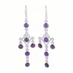 Twelve impressive stones of purple amethyst dangle from the ears in a pair of chandelier earrings presented by Parul. Local artisans handcraft the earrings using sterling silver with beautiful openwork to link the stones for a majestic addition to your wardrobe. Nickel-free Purple Dangle Chandelier Earrings, Elegant Purple Dangle Chandelier Earrings, Handmade Purple Sterling Silver Chandelier Earrings, Nickel-free Purple Chandelier Earrings Gift, Purple Dangle Chandelier Earrings, Sterling Silver Gemstone Chandelier Earrings For Gift, Silver Gemstone Chandelier Drop Earrings, Silver Gemstone Drop Chandelier Earrings, Purple Drop Chandelier Earrings As Gift