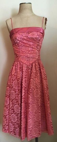 "Beautifully feminine pink lace & satin party dress with basque waist and ruching is a custom made creation from the 1980's. Dress has spaghetti straps, zips up in the back and is lined in satin. Dress is in excellent condition. Chest 32\"-34\" Waist 26\" Hips 44\" plus Length from armpit to hem 35\" All vintage is sold in \"as-is\" condition. We do our best to inspect, correct, and list important flaws. All measurements are made with the garment laying flat. Length is measured from shoulder 1980s Party Dress, Fitted Strapless Dress For Vintage Events, Pink Lace Dress With Spaghetti Straps, Vintage Lace Dress With Spaghetti Straps, Pink Lace Dress With Fitted Bodice, Vintage Dresses With Fitted Bodice And Spaghetti Straps, Pink Fitted Lace Dress For Formal Occasions, Formal Pink Lace Dress With Lace Bodice, Pink Lace Cocktail Dress