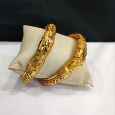 "This Pretty Traditional Pair of bracelet in gold plated Alloy Material. Design: Floral Pattern Color-Gold. Material-Metal/Alloy Available sizes :     2'8 inches   2'10 inches  Obsessed with Indian Jewelry! This is traditional gold-tone jewelry which is carved from our Indian artist. This jewelry are great touch on your collection.  Color may be difference because in few cases color may be different from monitor setting. About Us:  \"Vintage RIvaaz\" works in order to achieve customer satisfacti Yellow Gold Plated Bangle For Puja, Gold Meenakari Bangle For Marriage, Yellow Gold Meenakari Bracelet For Puja, Gold Plated Temple Jewelry Bracelets For Puja, Yellow Gold Bangle Bracelet For Puja, Yellow Gold Bangle For Puja, Gold Bracelets For Marriage Diwali Festival, Gold Bracelets For Diwali Marriage, Gold Meenakari Bracelets For Puja