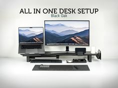 two computer monitors sitting next to each other on top of a desk with the words, all in one desk setup black oak