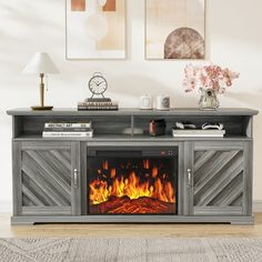 an entertainment center with a fireplace in it