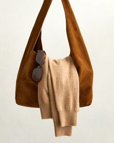 You've already got the cashmere crew and sunnies in your rotation, now it's time to level up your bag. Our Italian Suede Slouchy Shoulder Bag is giving timeless with its buttery-soft calf suede, elevated silhouette, and rich Whiskey hue. Always fairly priced at $119.90. Chic Suede Bag For On-the-go, Chic Suede Hobo Bag With Leather Handles, Chic Suede Hobo Bag, Chic Suede Hobo Bag With Removable Pouch, Chic Suede Hobo Bag For Everyday, Chic Everyday Suede Hobo Bag, Versatile Suede Hobo Bag With Soft Leather, Versatile Suede Hobo Bag With Soft Leather Details, Chic Suede Hobo Bag With Soft Leather