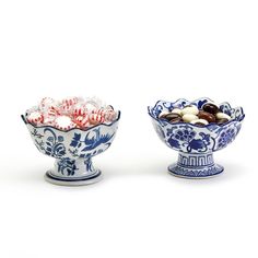 two blue and white bowls filled with candy