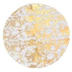 a round gold and white area rug with an abstract design in the middle, on a white background