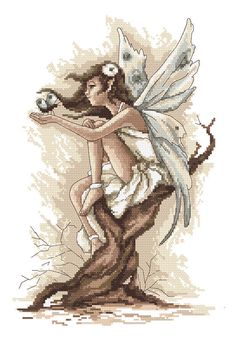 a cross stitch picture of a fairy holding a cat on top of a tree stump