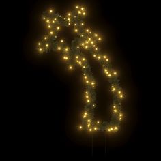 the letter s is made up of lights and garlands in the shape of a christmas tree