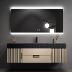 a bathroom vanity with two lights and a mirror above it that is lit up in the dark