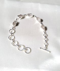 Item specifics ( 100 % Natural Gemstone Jewelry ) Gemstone  Herkimer Diamond Shape  Rough  Jewelry Type  Silver Bracelets Purity  925 Sterling Silver  Quantity  1 Pieces Handmade Designer Silver Jewelry                                                                                                                Description                                                                                                       STAMPED 925 STERLING SILVER ? This beautiful Item is made from the fines Adjustable Silver Diamond Bracelet With Gemstones, Sterling Silver Faceted Bracelets, Faceted Sterling Silver Bracelets, Sterling Silver Faceted Round Bracelets, Round Sterling Silver Bracelets With Faceted Details, Adjustable Silver Crystal Bracelet With Stones, Silver Gemstone Chain Bracelet, Sterling Silver Bracelets With Stones, Silver Faceted Bangle Bracelet