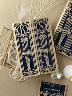 the wedding stationery was designed to look like art deco gatsby doors and are embellished with pearls