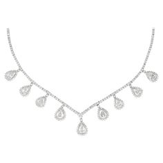 Exquisite dangling old pear cut diamond high jewelry necklace. 390 diamonds total, 15.91 carats total. 9 old pear cut diamonds 9.81ct, approximately I/J color and VS2/SI1 clarity. 381 round brilliant diamonds 6.10ct, approximately H/I color and SI clarity. Prong set in 18k white gold. Accommodated with an up-to-date appraisal by a GIA G.G. once purchased, upon request. Please contact us with any questions. Item Number N6171 Diamond High Jewelry, High Jewelry Necklace, South Sea Pearl Necklace, Diamond Drop Necklace, Diamond Tennis Necklace, Gold For Sale, Pear Cut Diamond, Dangle Necklaces, Baguette Cut Diamond