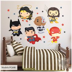 the wall decals in this children's bedroom are super heros