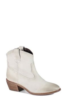 This abbreviated Western boot shaped from smooth leather is the perfect way to add a kick to your casual style, while the cushioned footbed ensures walkable comfort. 2" heel 5" shaft Pull-on style Cushioned footbed Leather upper/synthetic lining and sole Imported White Mid-calf Boots For Rodeo In Fall, White Low-top Boots With Textured Sole, White Faux Leather Mid-calf Boots With Pointed Toe, White Western Mid-calf Boots With Wide Calf, Fitted White Western Mid-calf Boots, Western Boots Women, Western Boot, Western Boots, Boot Shoes Women